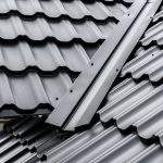 Construction of the roof of the house. Metal tiles.