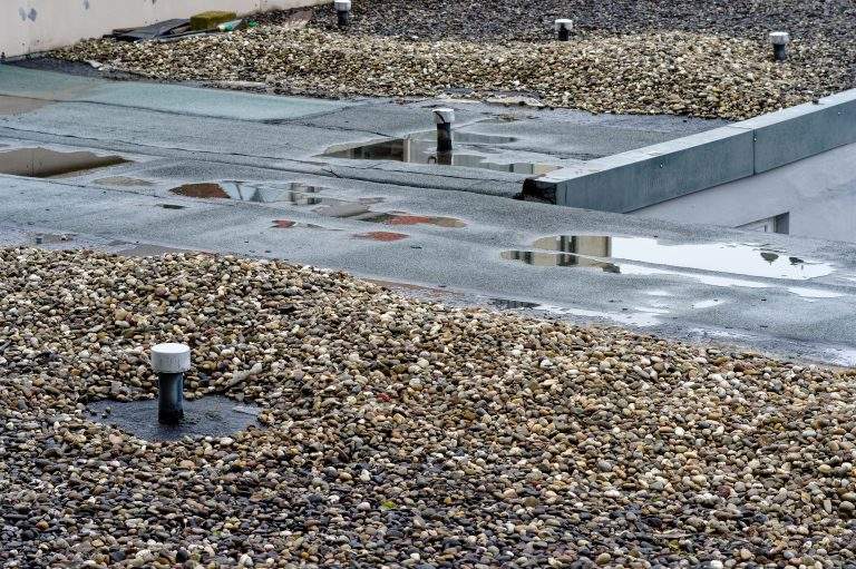 Broken flat roof with macro with broken rubber