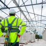 Asian senior engineer technician construction wearing safety harness and safety line working in construction site