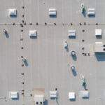 looking down on a commercial rooftop showing skylights and HVAC equipment