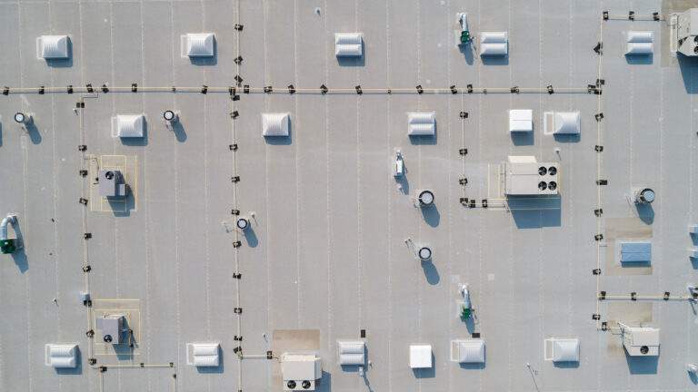 looking down on a commercial rooftop showing skylights and HVAC equipment